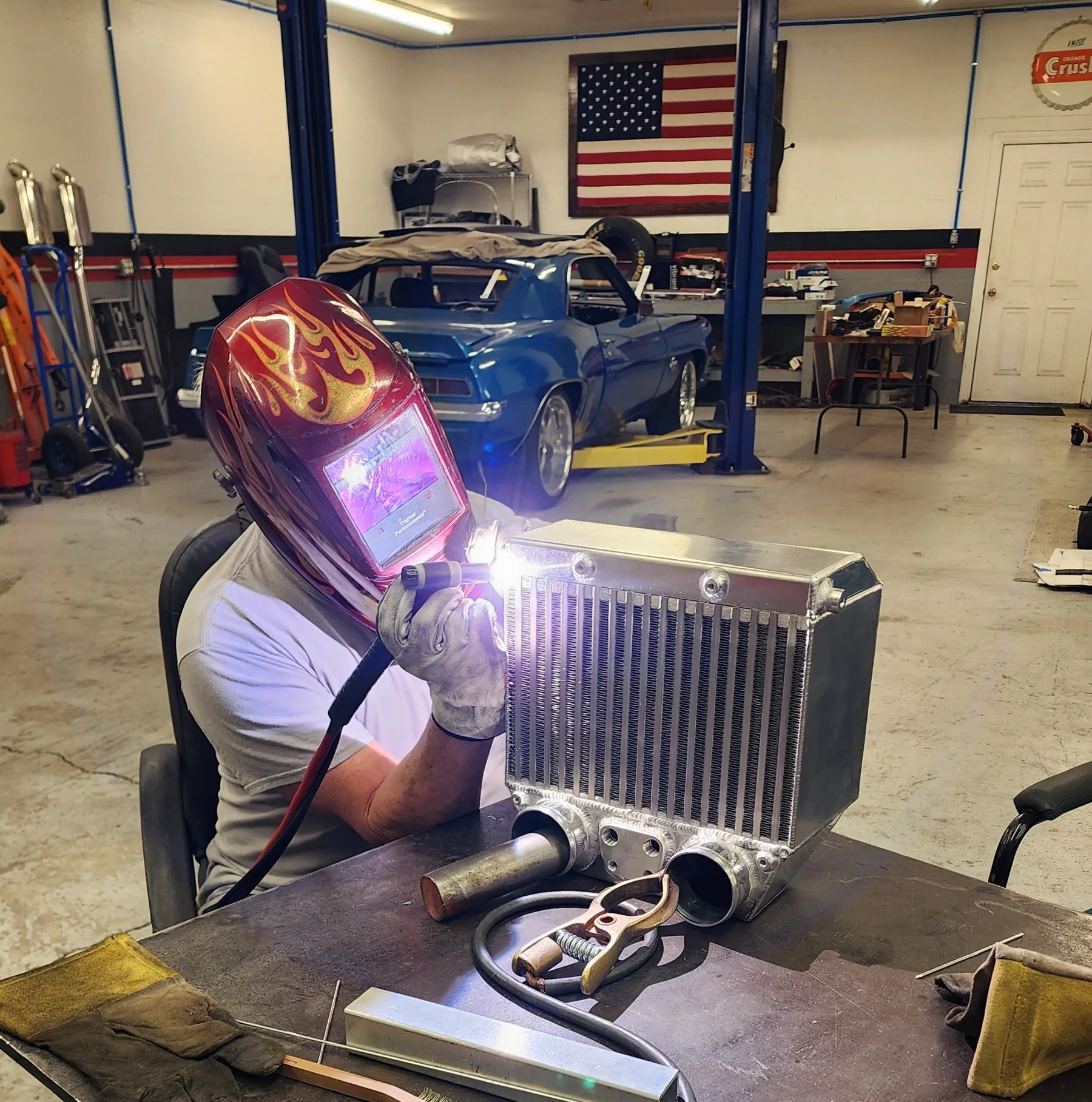 TIG welding the custom aluminum side-mount intercooler during fabrication