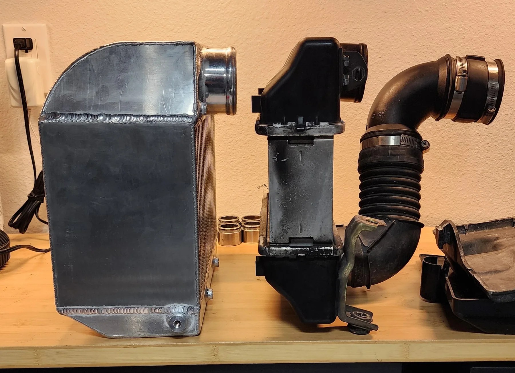Side profile comparison of the custom intercooler and original intake and intercooler assembly